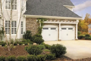 modern garage door, white with arbor over doors