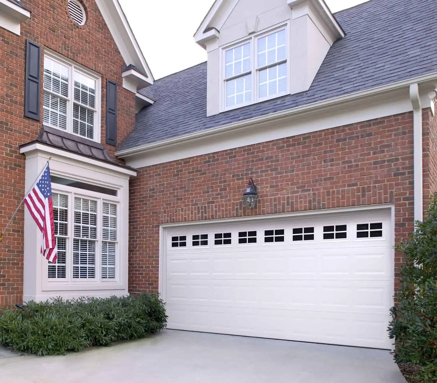 white classic overhead door on brick home