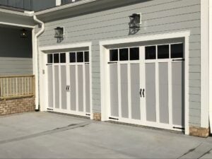 white and gray garage door double car garage decorative hardware and windows