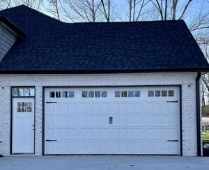 white automatic door with decoratve hardware and windows
