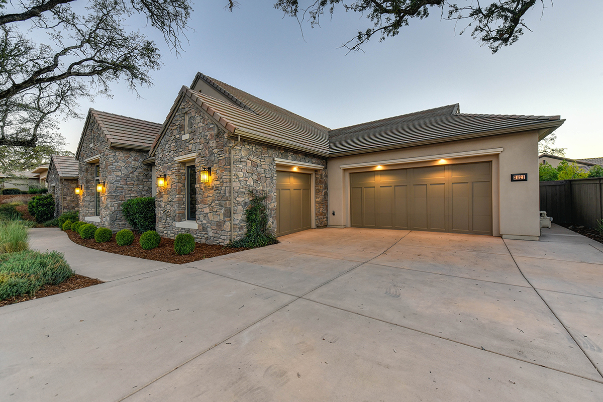 garage door lit at night after a spring repair being done by skylift team 