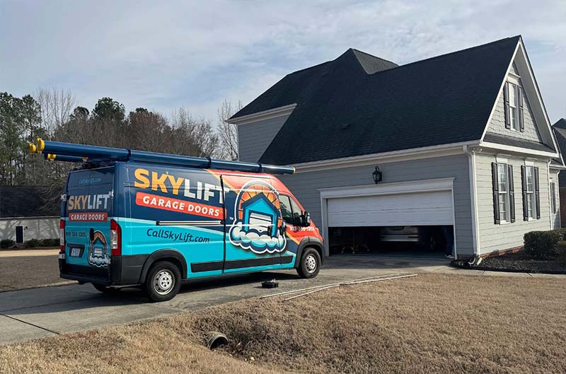branded truck infront of new garage door install