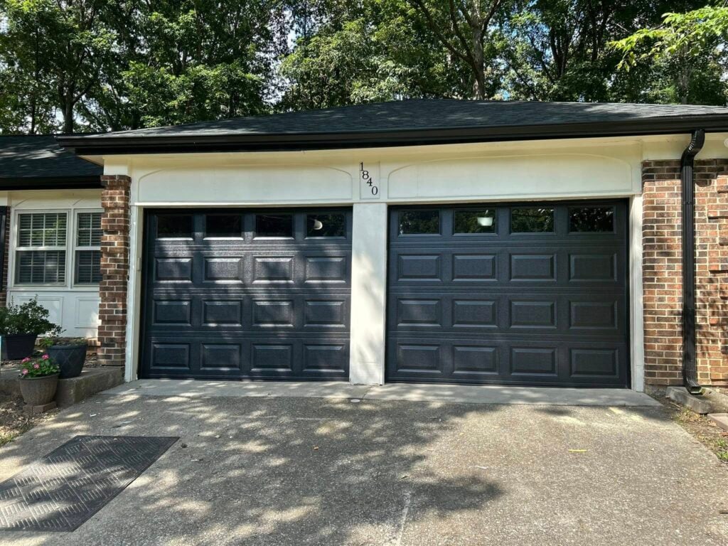 black garage door with window inserts at local home in Corryton