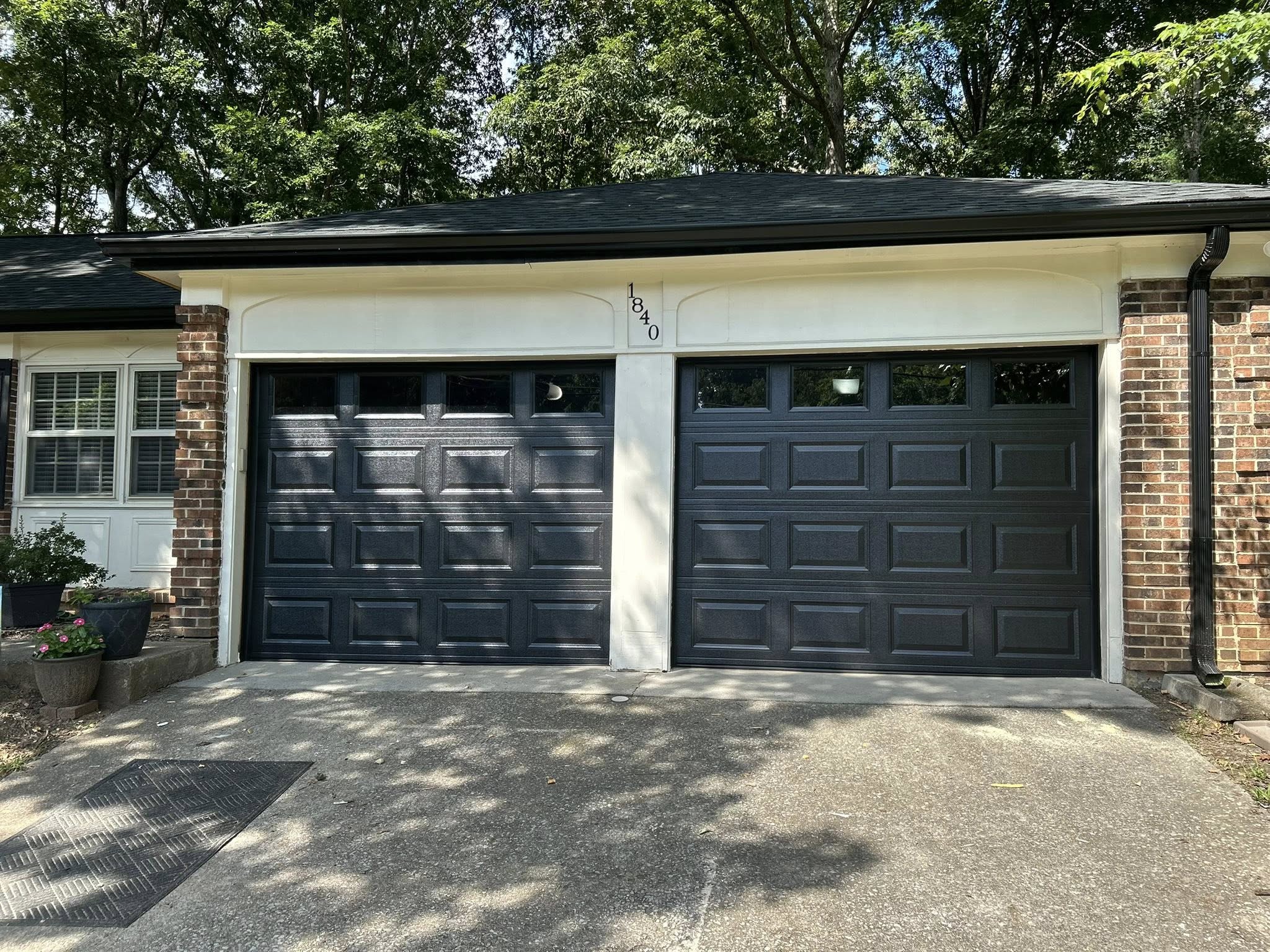 black garage door with window inserts
