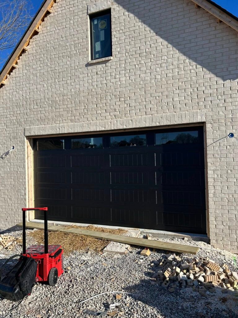 black garage door newly repaired by skylift team